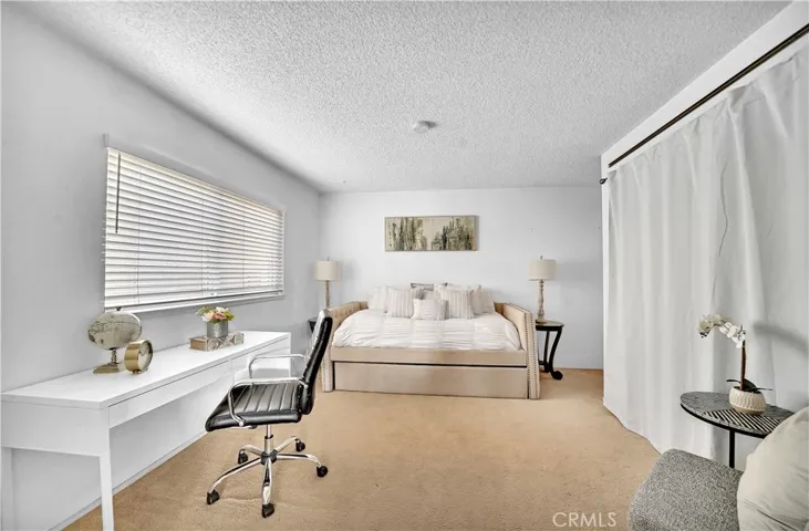 The downstairs bedroom provides an ideal space for family or guests, with easy access to a bathroom featuring a tub/shower combo.