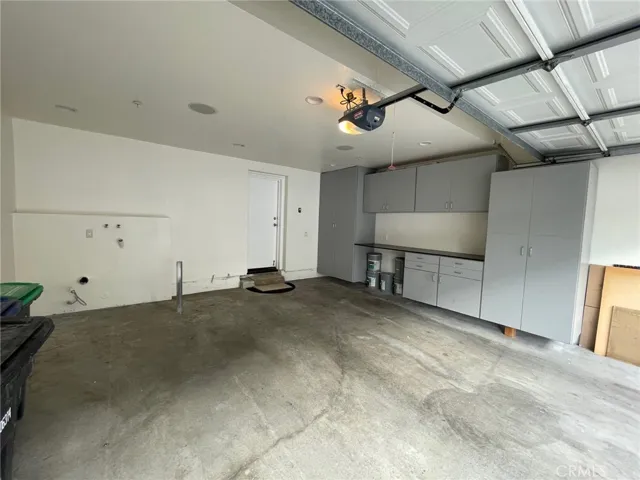 2 car attached garage with direct access, built in storage and laundry hookups