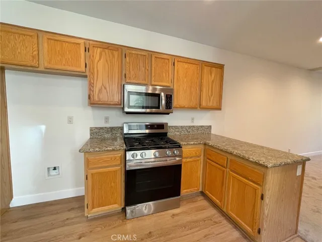 kitchen show with stainless steel gas stove