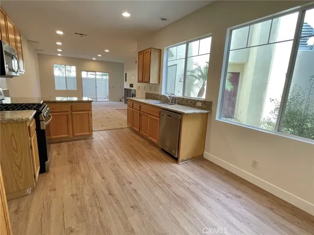 Luxury laminate flooring in kitchen and area for dining nook