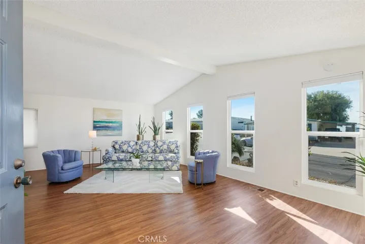 Sit a spell in the light and bright living room and  enjoy the view.