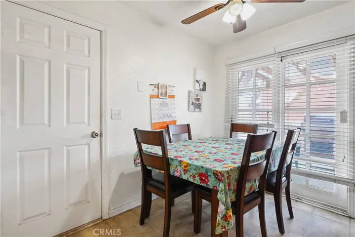Dining area in kitchen, overlooking the backyard & door leading to the back.