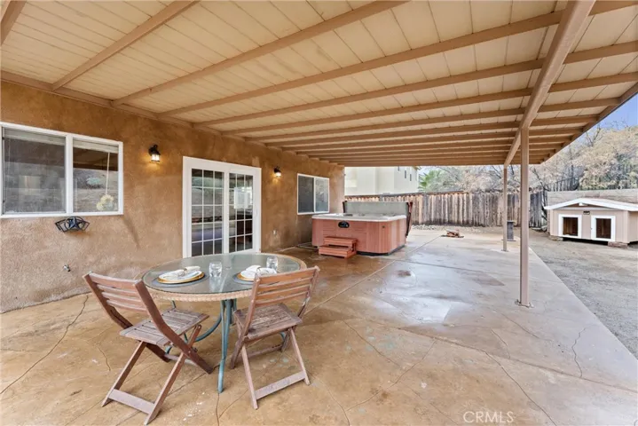 Covered patio with slider from Kitchen/Family Room