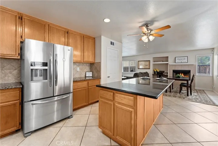 Walk-In Pantry and oversized island with Breakfast Bar seating along 2 sides