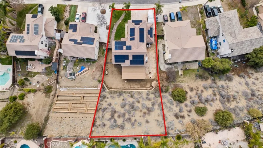 Large lot - main level is pool sized, upper slope can be terraced