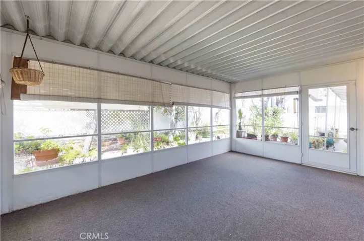 Large covered patio with new carpet