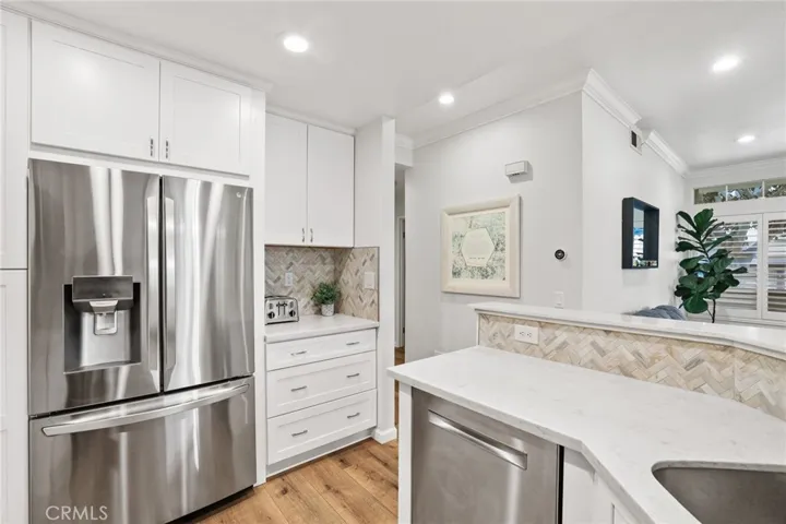 The kitchen features plenty of cabinets.