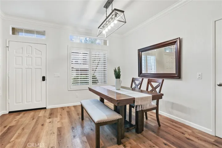This dining room also features beautiful dual fold plantation shutters. There is a deep storage closet with access door on the right.