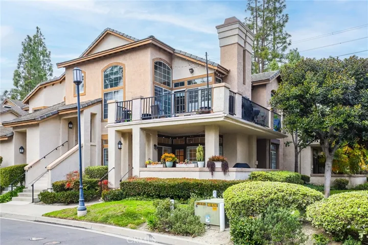 Another view of the corner unit condo with beautiful covered patio with privacy.