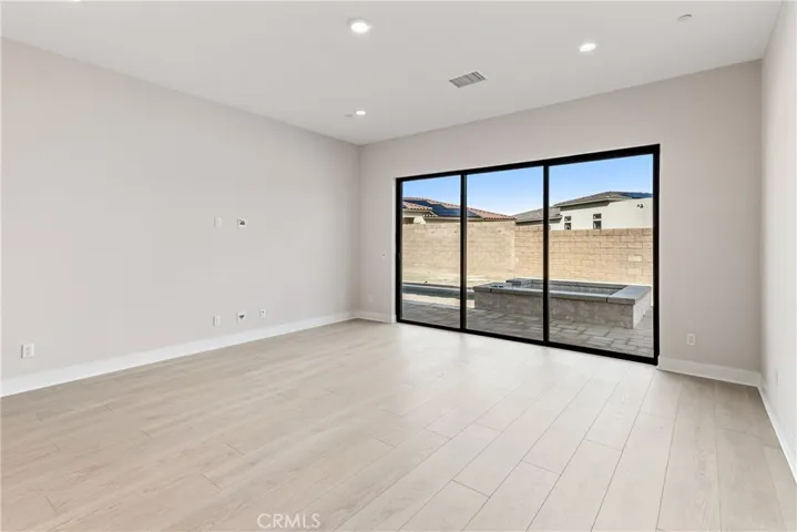 Primary bedroom with sliding room to backyard and pool area