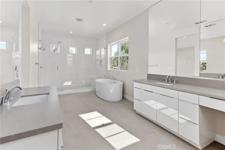 Primary Bathroom with shower, soak in bath and dual sinks