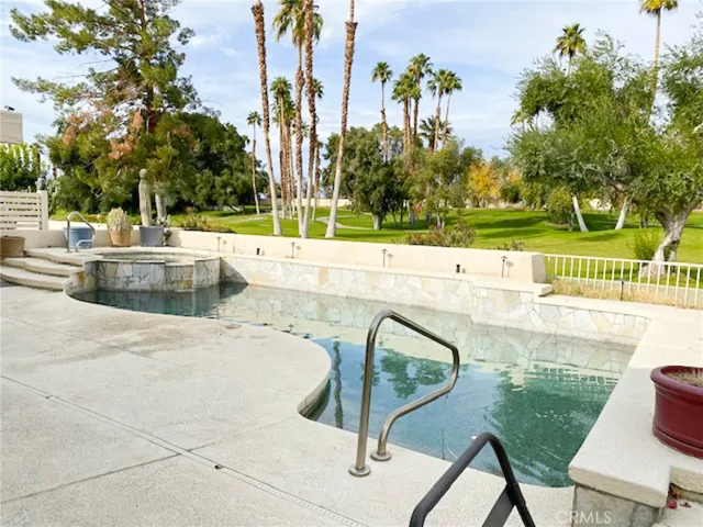 Patio pool and golf course view