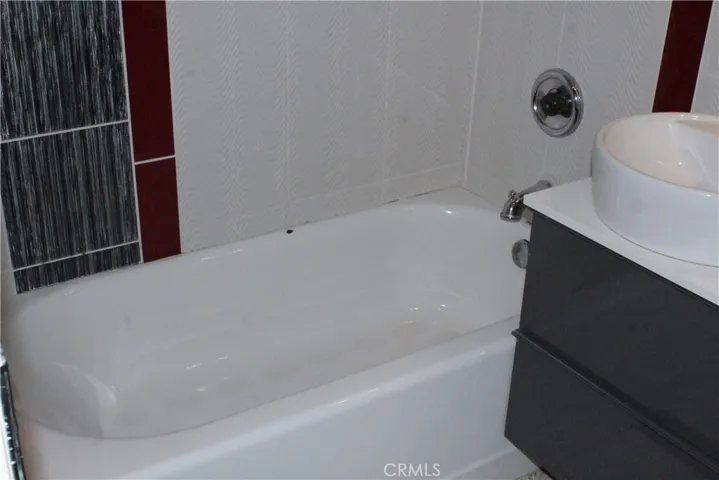 Designed tile walls and ceiling in master suite  bathroom