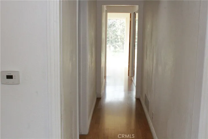 Hallway to the two bedrooms and bath