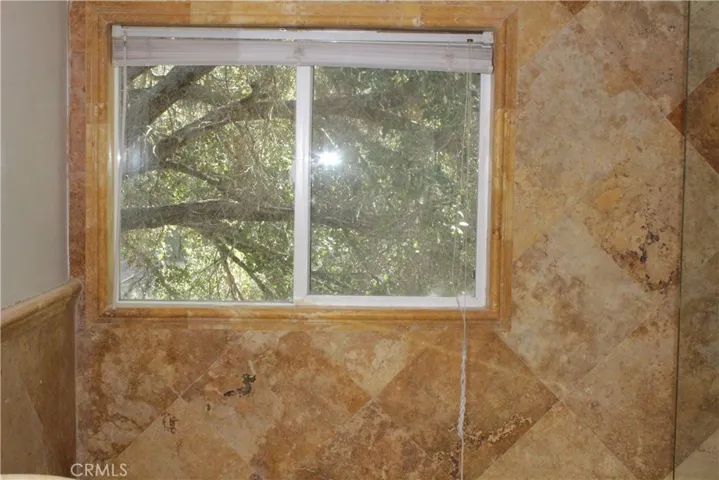 Window overlooking nature in shared bathroom