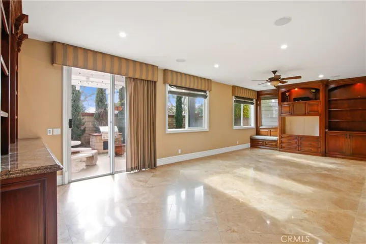 Lower level family Room with custom wall cabinet built ins