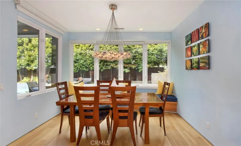 Comfortable dining nook for breakfasts and casual dining.  Built in window seat with storage too.