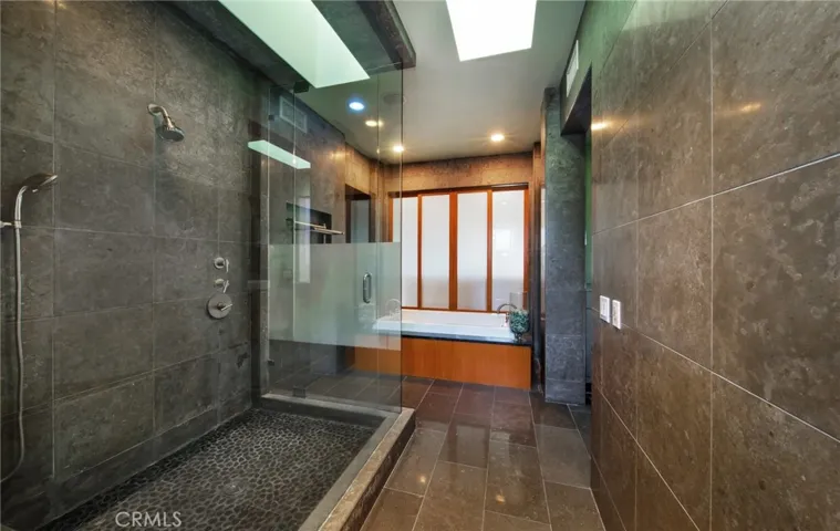 Steam shower and jetted soaking tub in the oversized Master bath area.