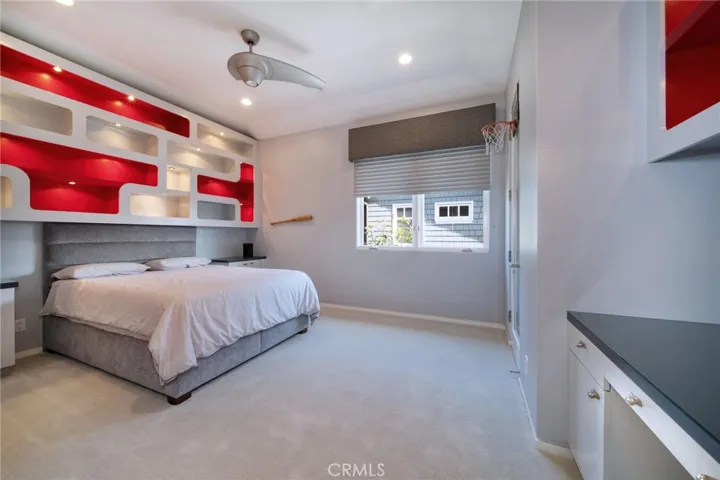 Bedroom 4 with custom built-ins and walk-in closet.