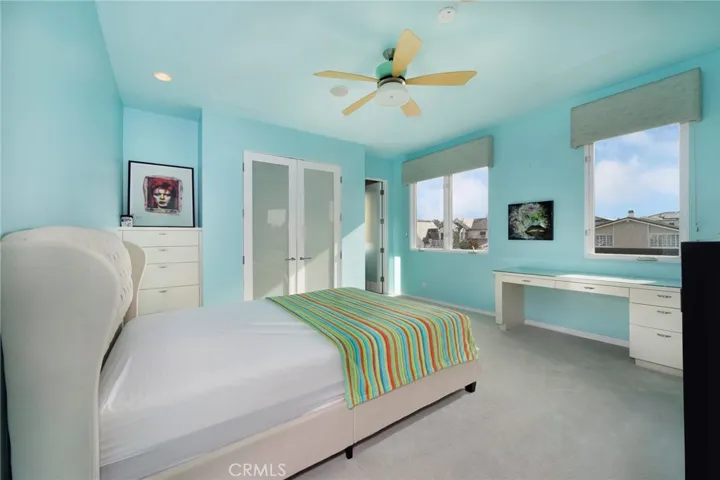 2 of 2 secondary ensuite bedrooms with balcony access.