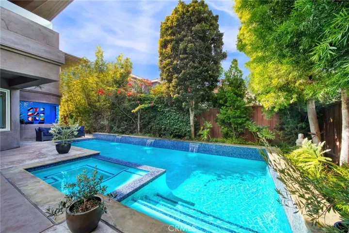 Enjoy summer days in the lap pool with a waterfall feature and spa.