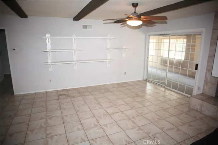Family room w/Fireplace and access to covered patio