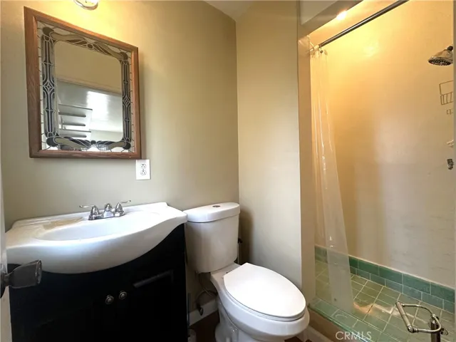 Unpermitted one bath attached to the garage.