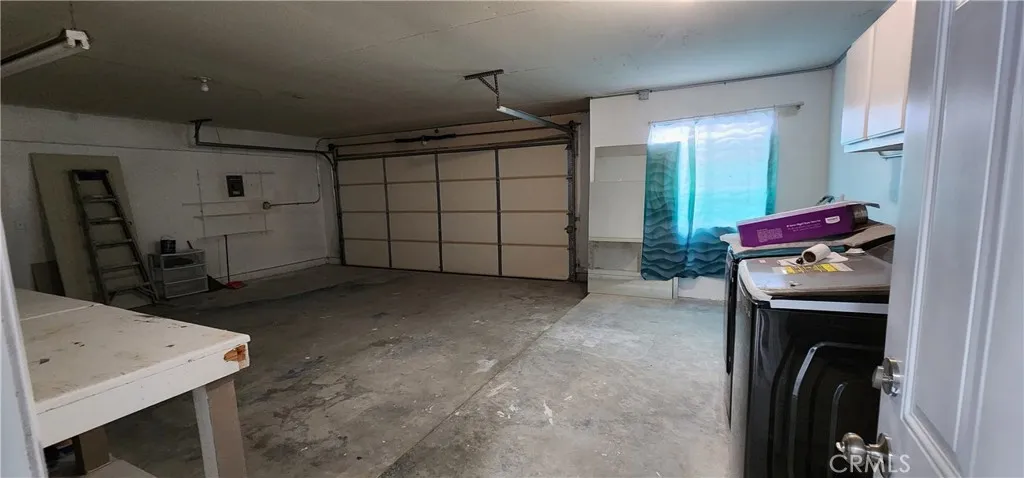 Huge garage with working table, right side newly installed washer and dryer!