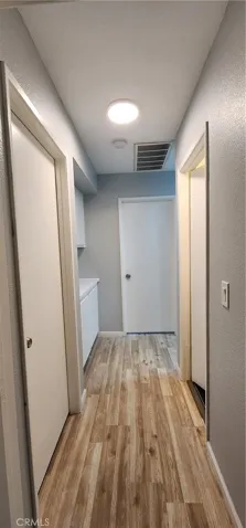hallway view between bedrooms and master suite