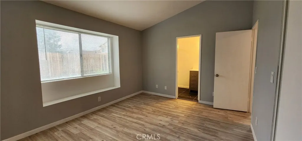Open door shows your private master bathroom