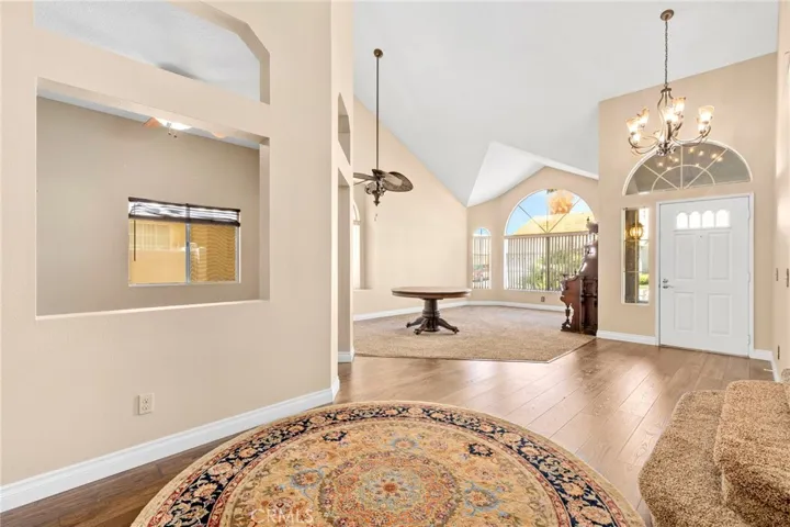 Looking back at front door and formal living area with library at the left