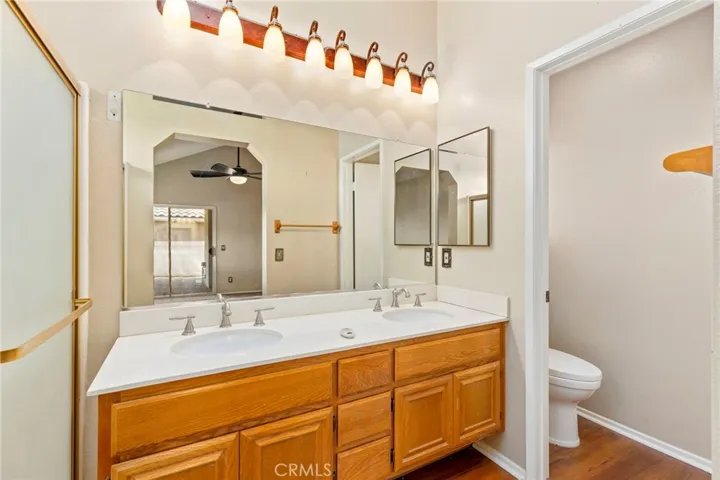 Master bathroom with dual sinks and step in shower