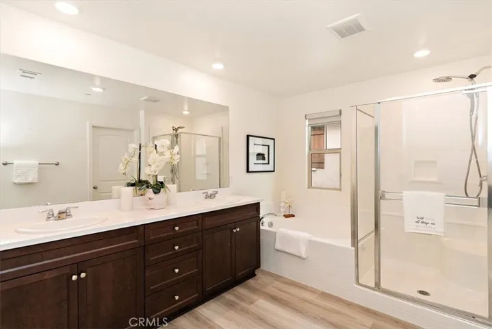 Primary bathroom.  Dual sinks, soaking tub and walk-in shower