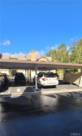 Covered Carport #157 right outside your garage door!