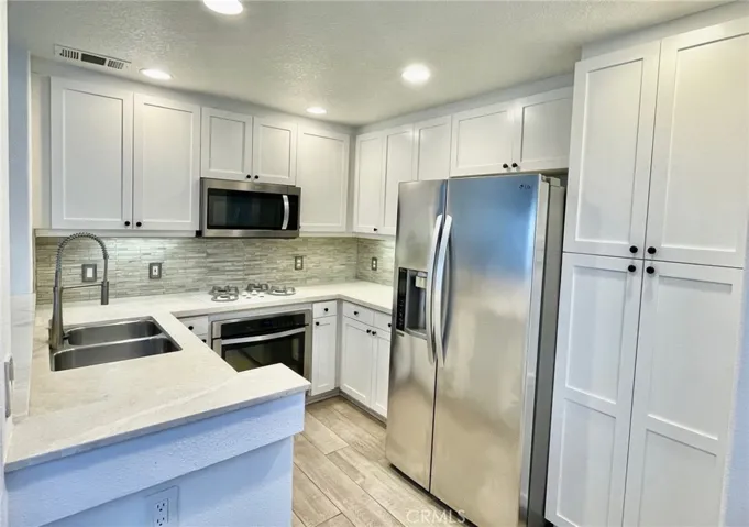upgraded kitchen with stainless steel appliances