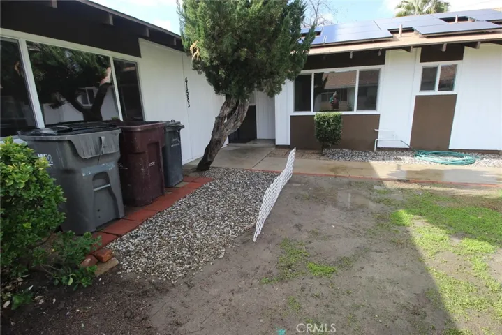 NEW front door to 41583 is in corner (behind tree trunk)
