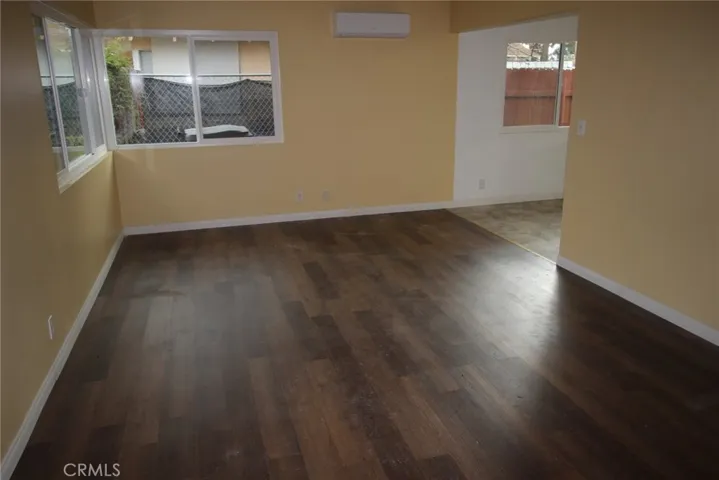 living room 41583 NEW flooring & ductless HVAC system, edge of dining area off kitchen