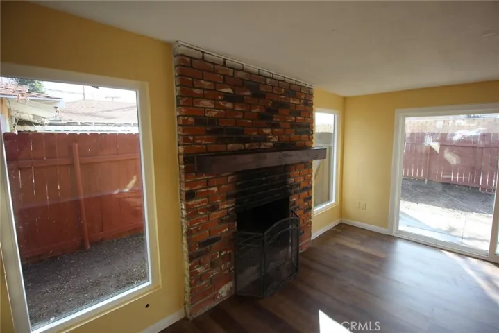 fireplace in "bonus" family room, large NEW windows....a portion of the 12' slider leading to private rear yard...41583