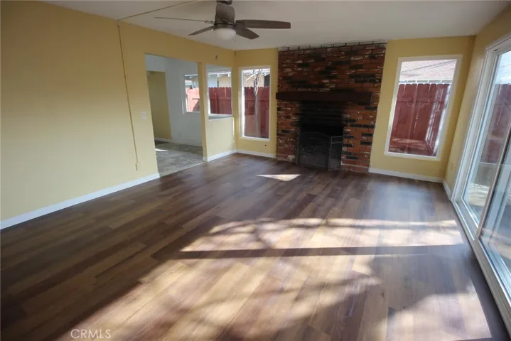 fireplace with NEW wood mantle......large windows each side of fireplace....41583