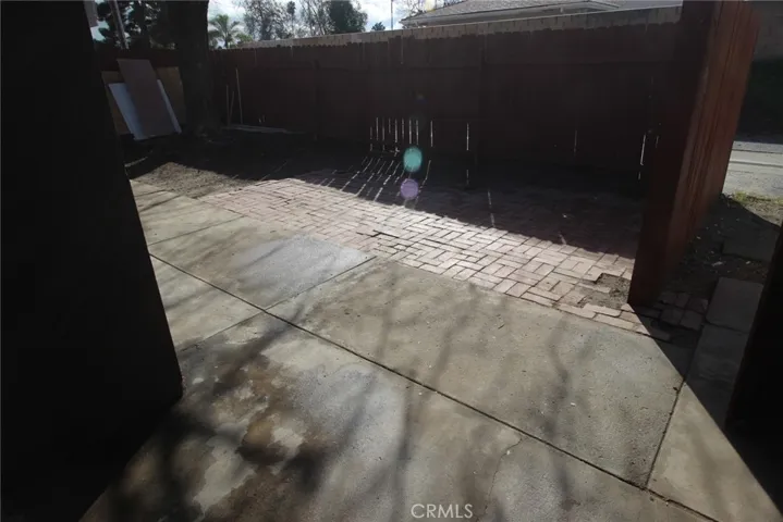 semi-finished rear yard...lots of bricks...ready to be finished off as new buyer desires.......open gate leading to alley in rear and front of garages