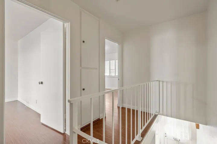 Hallway between bedrooms include storage cabinets