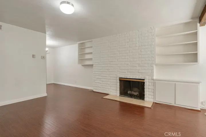 There's ample shelving and storage space in the living room
