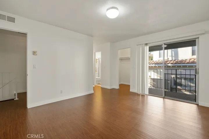 Spacious primary bedroom, complete with personal walk out balcony
