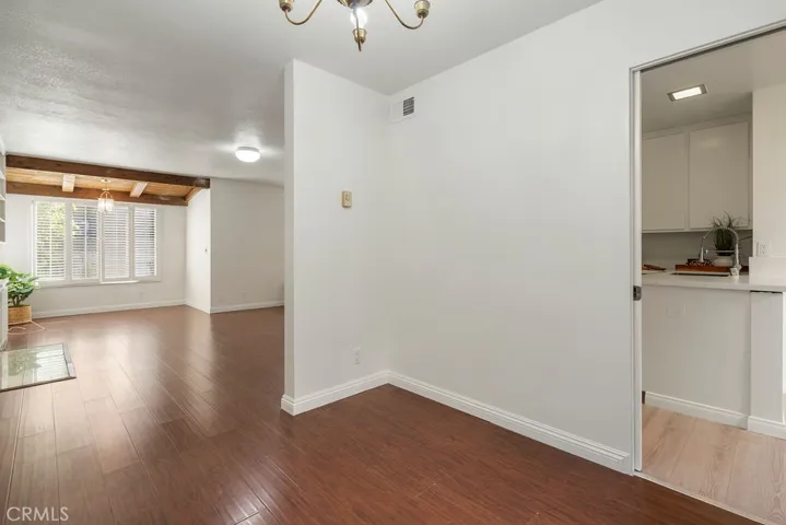 Living room opens up into dining area