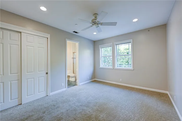 Bedroom #6 which is upstairs, note the recessed lighting and ceiling fan.