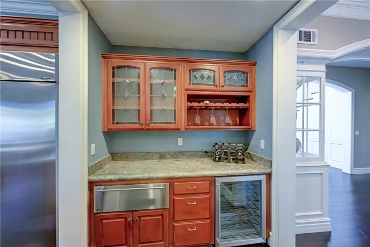 Butler's pantry with mini fridge and warming tray.