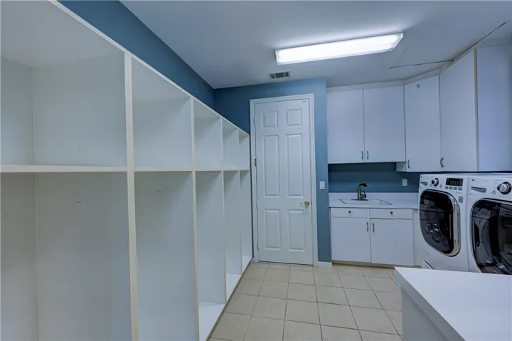 Enter off the garage to a mud room, perfect for each person's items.
