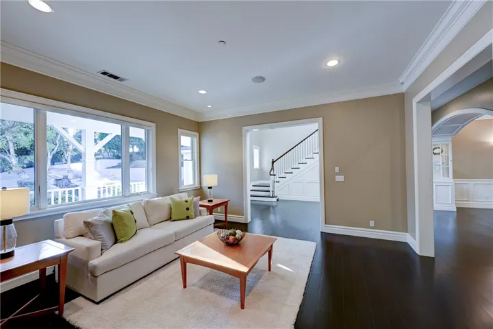 Note the stunning hardwood flooring here in the formal living room and throughout this home.