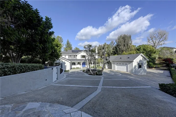 Expansive driveway has space for over 10 cars.

