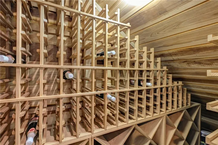 In a closet in the office is this spacious wood lined wine closet that is estimated to hold up to 800 bottles of wine.